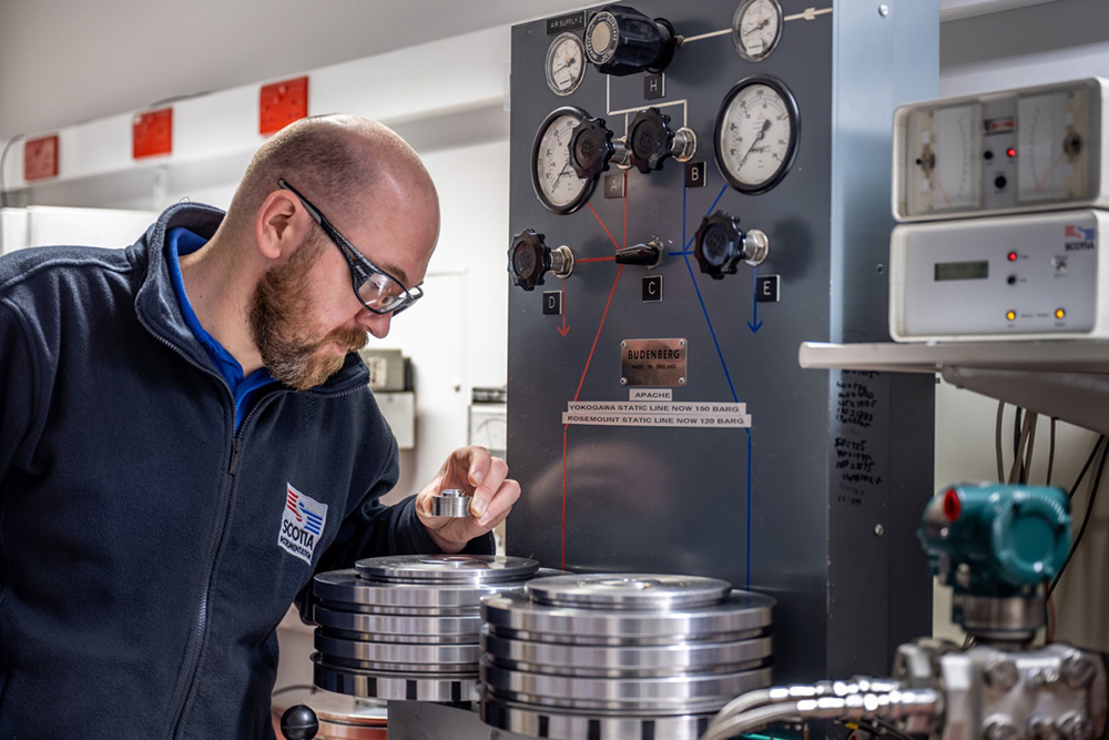 Scotia Instrumentation technician working in the UKAS pressure laboratory